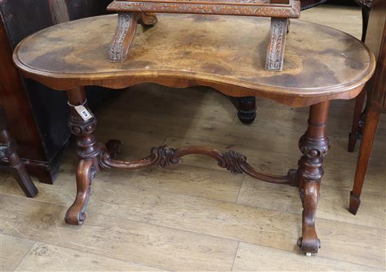 A Victorian figured walnut kidney shaped side table W.120cm